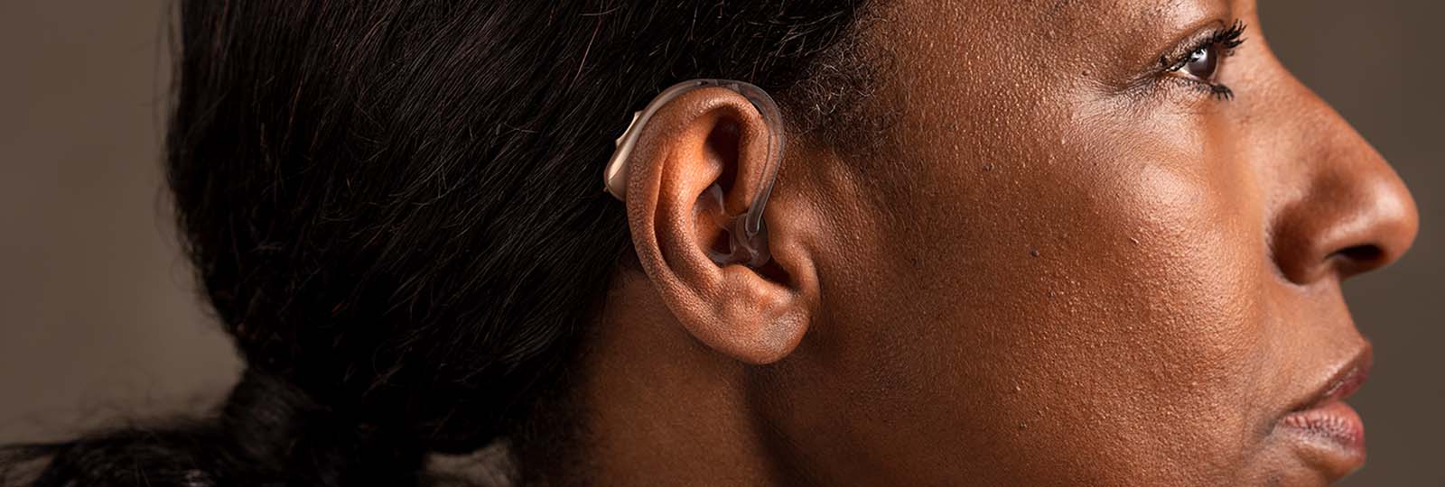 Woman with BiCore B M hearing aid