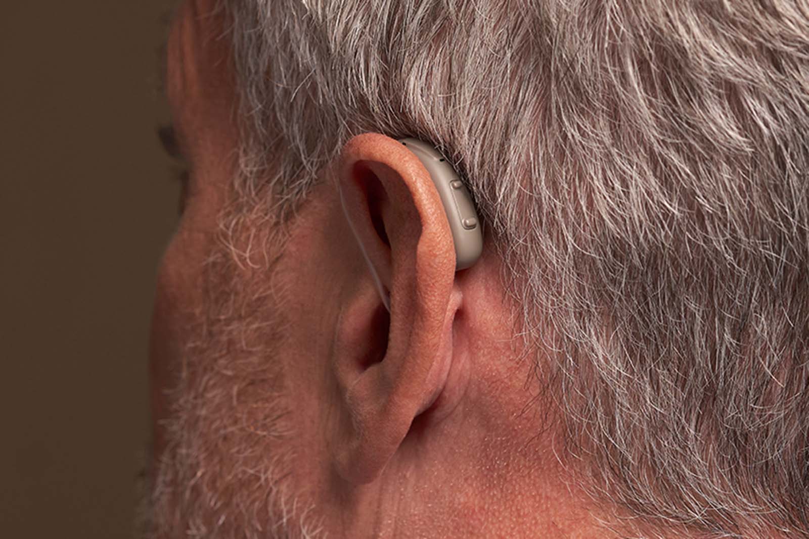 Man wearing Rexton BiCore Rugged hearing aid
